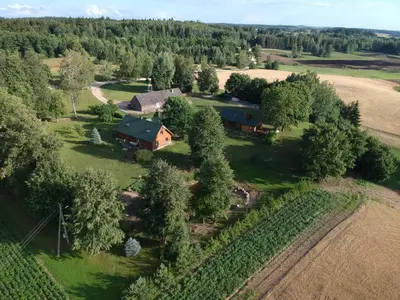 an aerial view of a farm with a house at Gintaro sodyba in Lazdijai
