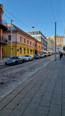 a street with cars parked on the side of a road at RBRoom in Vilnius