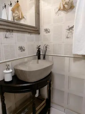 a bathroom with a sink and a mirror at Naktakės apartamentai in Kupiškis