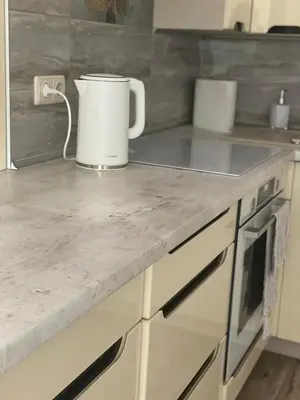 a kitchen counter with a bucket on top of it at V15 Apartment in Druskininkai