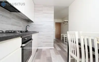 a kitchen with a sink and a counter top at Nemuno apartamentai in Panevėžys