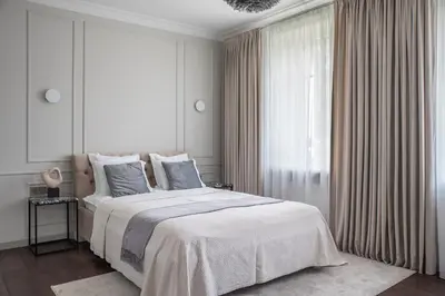a bedroom with a large bed and a window at Place No. 2 in Vilnius
