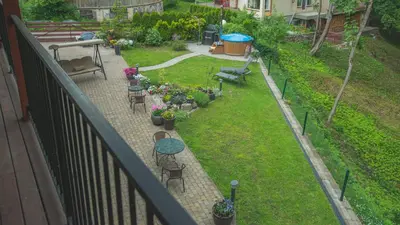 an aerial view of a garden with tables and chairs at Senasis Nemunas in Druskininkai