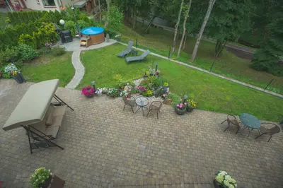 an aerial view of a garden with chairs and flowers at Senasis Nemunas in Druskininkai