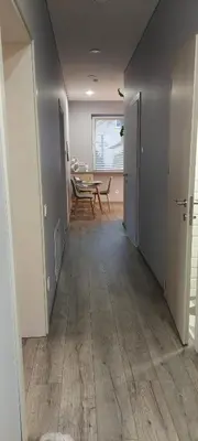 an empty hallway with a table and a dining room at Čepinskio in Kaunas