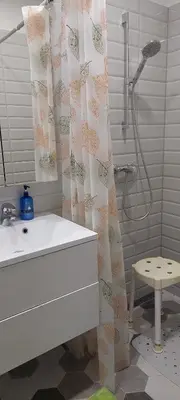 a bathroom with a sink and a shower curtain at Čepinskio in Kaunas