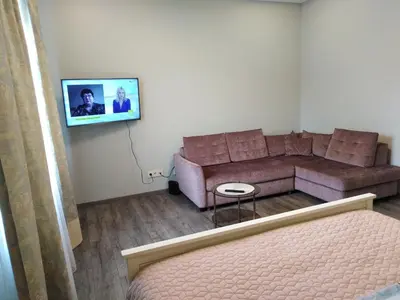 a living room with a couch and a tv at Čepinskio in Kaunas