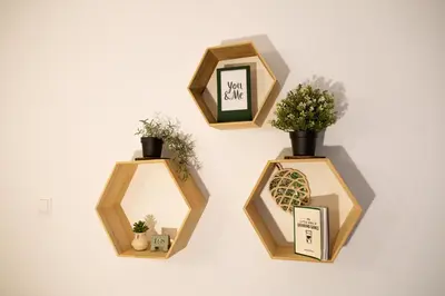 four wooden boxes with plants in them on a wall at Visaginas Flat White in Visaginas