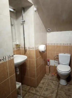 a bathroom with a toilet and a sink at HelloVilniusHostel in Vilnius