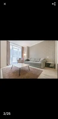 a living room with a couch and a coffee table at HaPPy Inn Rich Studio, Self Check-In-24x7,Parking-in-the-underground-Garage in Vilnius