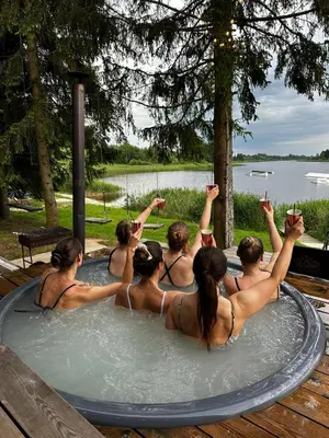 a group of people in a jacuzzi tub at Wakepond atostogų slėnis in Anykščiai