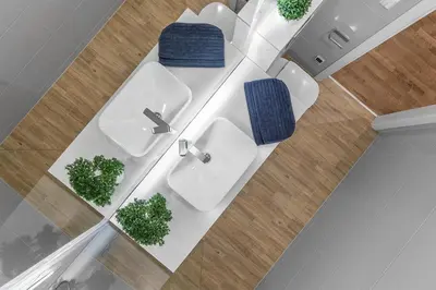 an overhead view of a bathroom with two sinks and plants at Brand new apartment in Vilnius in Vilnius