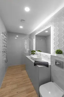 a white bathroom with a sink and a mirror at Brand new apartment in Vilnius in Vilnius