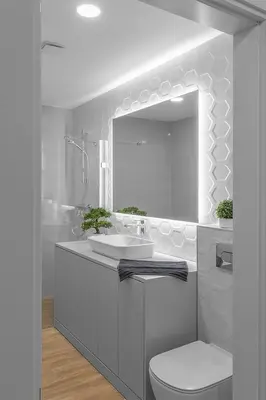a bathroom with a sink and a toilet and a mirror at Brand new apartment in Vilnius in Vilnius