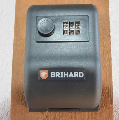 a black button on a wooden box with the word birmingham at Royal Resident in Druskininkai