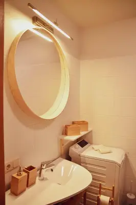 a bathroom with a sink and a mirror at Central Park Apartment Birštonas in Birštonas