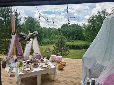 a table and chairs on a deck with a view at Domingo vila in Krosna
