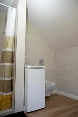 a small bathroom with a toilet and a shower at Domingo vila in Krosna
