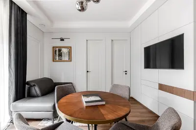 a living room with a table and a couch at Luxurious Apartment in Vilnius Old Town by Reside Baltic in Vilnius