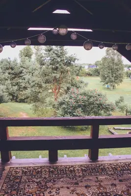a view of a park from a fence at Namelis Rudnios kaime “Nykštukas” in Rudnia