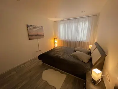 a small bedroom with a bed and a window at Ateities 3044 Self CHECK In in Panevėžys