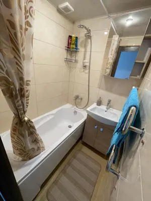 a bathroom with a tub and a sink at Ateities 3044 Self CHECK In in Panevėžys