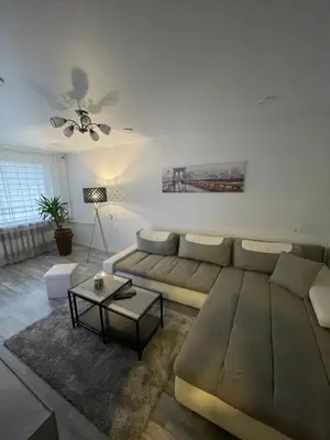 a living room with a couch and a table at Ateities 3044 Self CHECK In in Panevėžys