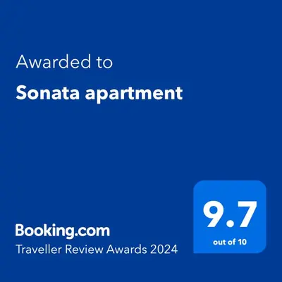 a blue screen with the text awarded to santa apartment at Sonata apartment in Panevėžys