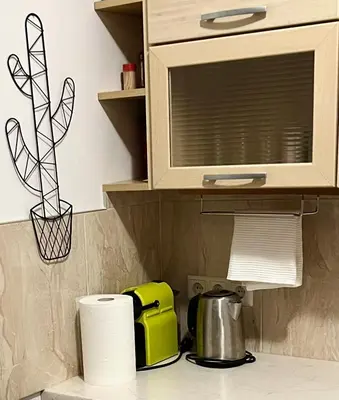 a kitchen counter with a microwave and some paper towels at CENTRO House in Alytus
