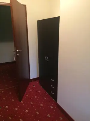an open door to a room with a red carpet at Liškiavos vienuolyno ansamblis in Liškiava
