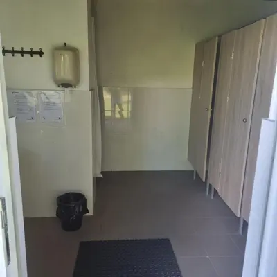 a room with a hallway with cabinets and a floor at Camp Genys in Jurbarkas