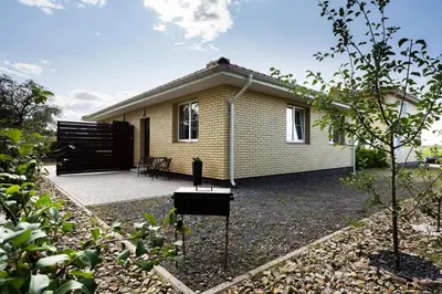 a small house with a patio in front of it at 3 Apartment Between two lakes in Vilnius