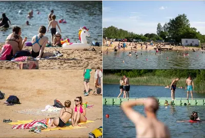 a group of people on the beach at a lake at 3 Apartment Between two lakes in Vilnius