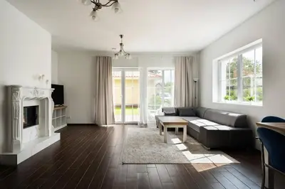 a living room with a couch and a fireplace at 2 House Between two lakes in Vilnius