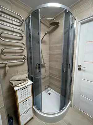 a bathroom with a shower with a glass shower at Forest Studio in Druskininkai