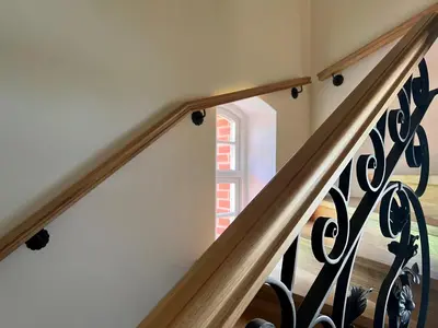 a set of stairs with a window in a house at Pakėvio dvaras - Pakevis manor in Kelmė