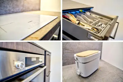 a kitchen with a counter and a drawer with knives at Kaunas City Center Deluxe in Kaunas