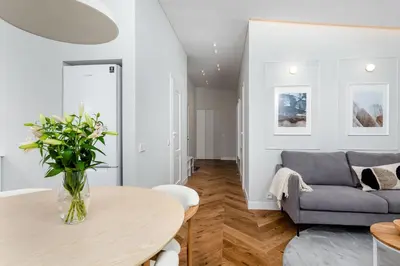 a living room with a table and a couch at V33 cozy apartment in Druskininkai