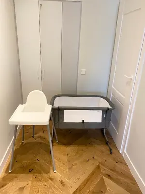 a hospital bed and a table in a room at V33 cozy apartment in Druskininkai