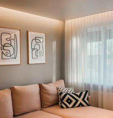 a living room with a couch and a window at Vytautas Park Apartment with FREE Parking in Marijampolė
