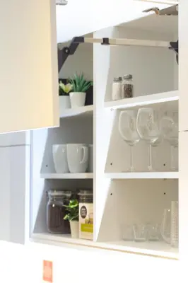 an open refrigerator with dishes and other items at cohost I OldTown 60m2 APT w-Garage Parking, Balcony & Self Check-in in Vilnius