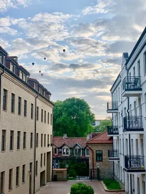 a view from between two buildings on a street at Uzupis Deluxe Retreat in Old Town Vilnius in Vilnius
