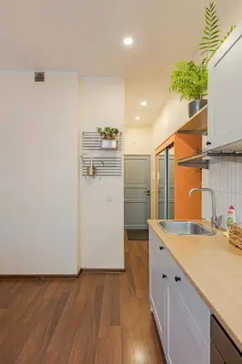 a kitchen with a sink and a counter top at Cozy studio and standard apartments in the heart of Oldtown in Vilnius