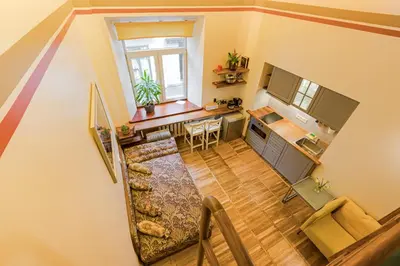 an overhead view of a kitchen and a living room at Cozy studio and standard apartments in the heart of Oldtown in Vilnius