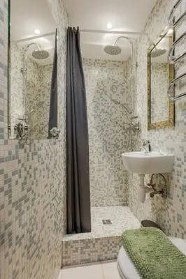 a bathroom with a shower and a sink and a toilet at Cozy studio and standard apartments in the heart of Oldtown in Vilnius