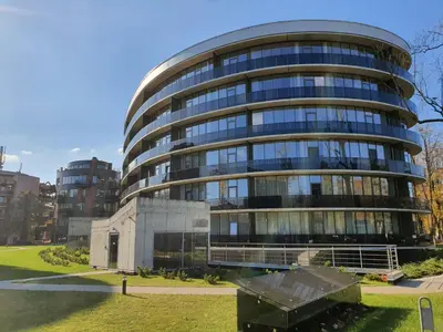 a tall building with a lot of windows at Apartment in Druskininkai City Centre in Druskininkai
