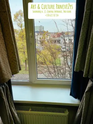 a window with a view of a city outside at Art & Culture Panevėžys in Panevėžys