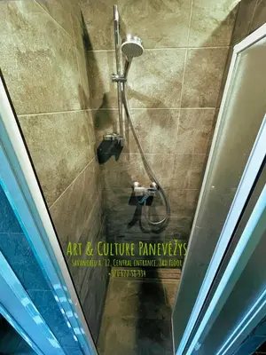 a shower in a bathroom with a shower head at Art & Culture Panevėžys in Panevėžys