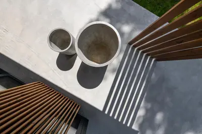 two buckets on the side of a building at The Lake - Waterfront Villas Retreat in Mindūnai