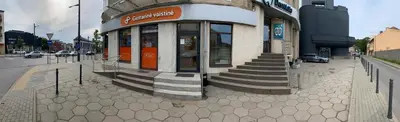 a building with stairs in front of it on a street at Mr Jo’s hostel in Kaunas